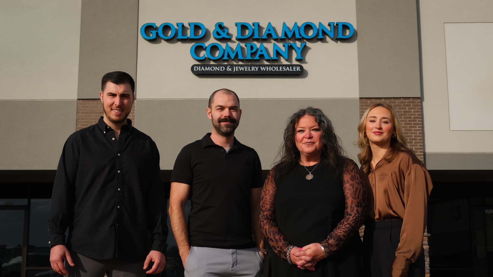 Gold & Diamond Company team in front of their Rogers, Arkansas storefront