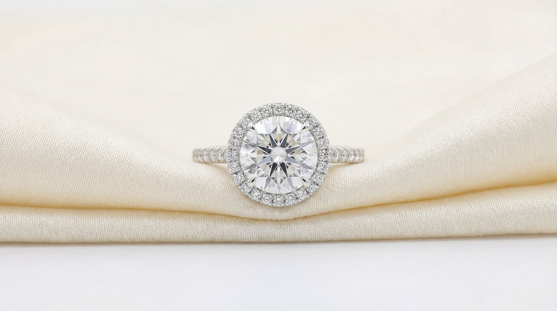 Halo diamond engagement ring on hand holding a bridal bouquet — Fayetteville, Arkansas