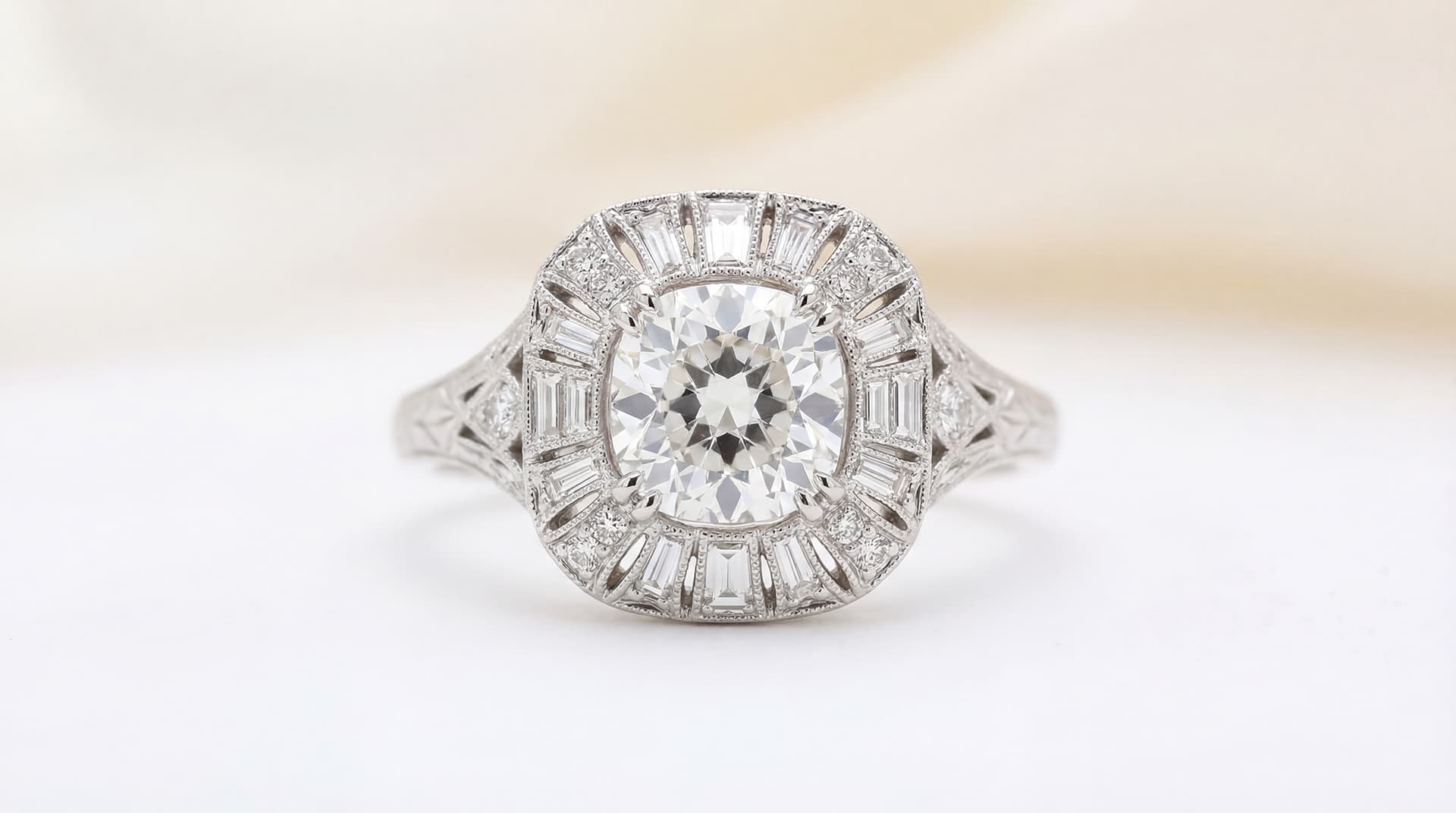 Vintage-style diamond engagement ring with ornate band detail in ring box — Gold & Diamond Company