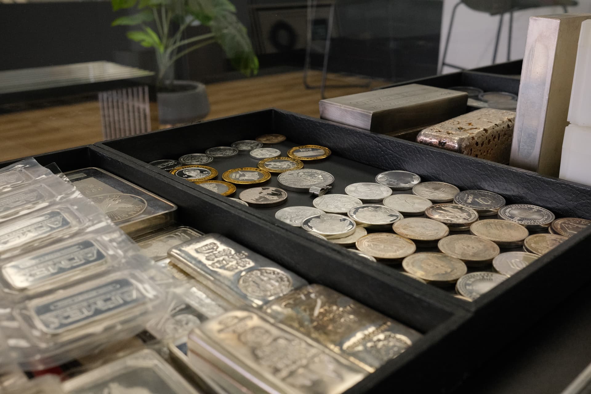 Silver coins and bullion on display at Gold & Diamond Company in Rogers, AR — sell your silver here